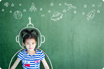 Young girl surround by chalk drawing of spacesuit imagining space exlporation with satelitles rockets stars and planets above her head